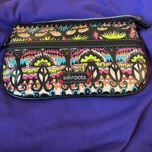 Sakroots small zip bag, vinyl on outside.